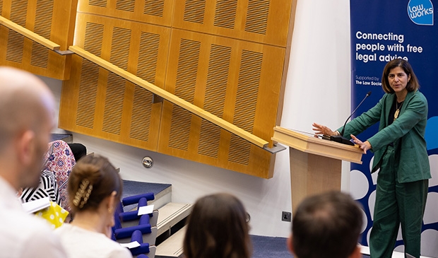 Sarah Sackman KC MP speaking to an auditorium of attendees at LawWorks Pro Bono Clinics Conference
