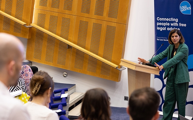 Sarah Sackman KC MP speaking to an auditorium of attendees at LawWorks Pro Bono Clinics Conference